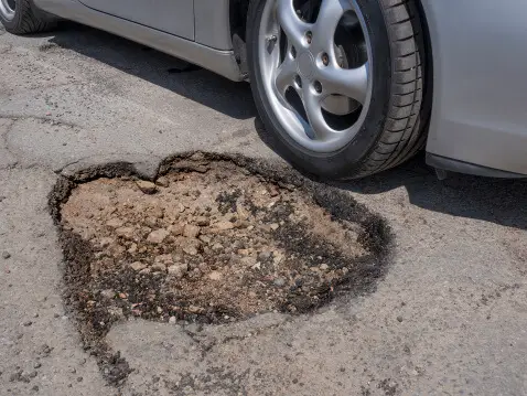 Potholes Can Cause Serious Damage. Here’s Why You Need to Avoid Them